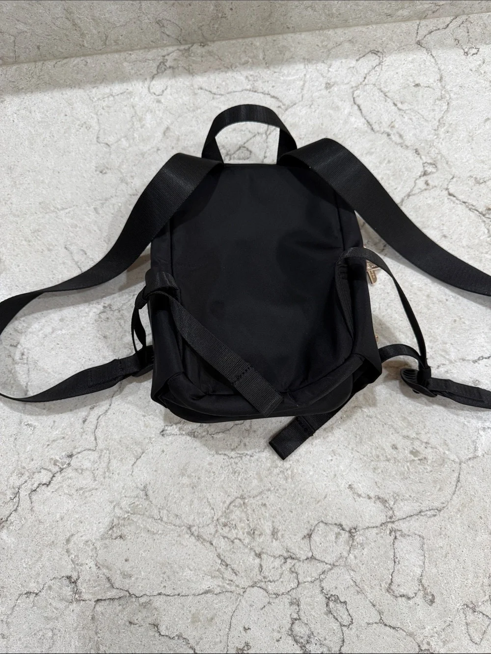 lululemon athletica Black Mini Backpack with Gold Accents. new without tags